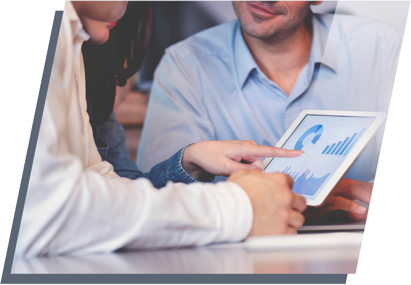 Woman pointing at graphs and charts on a tablet