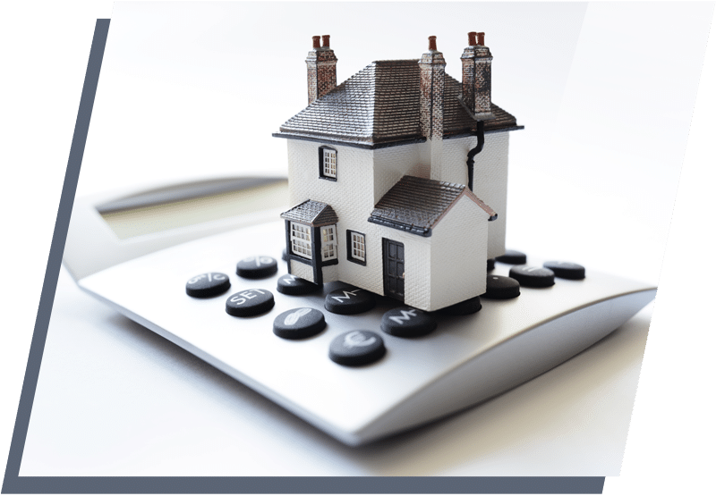 Miniature toy home on top of a calculator