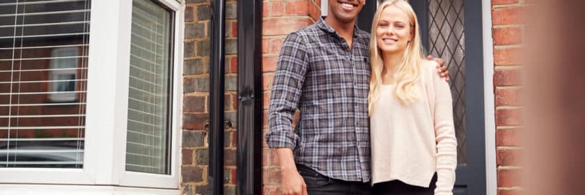 Portrait,Of,Proud,Young,Couple,Standing,Outside,First,Home,Together